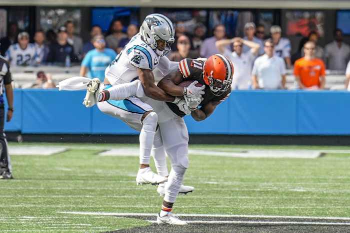 Sep 11, 2022; Charlotte, North Carolina, USA; Carolina Panthers safety Jeremy Chinn (21) tackles Cleveland Browns wide receiver Donovan Peoples-Jones (11) during the second half at Bank of America Stadium. Mandatory Credit: Jim Dedmon-USA TODAY Sports